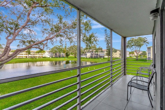 unfurnished sunroom with a water view