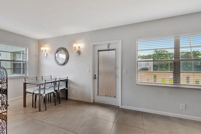 dining space with light tile patterned floors