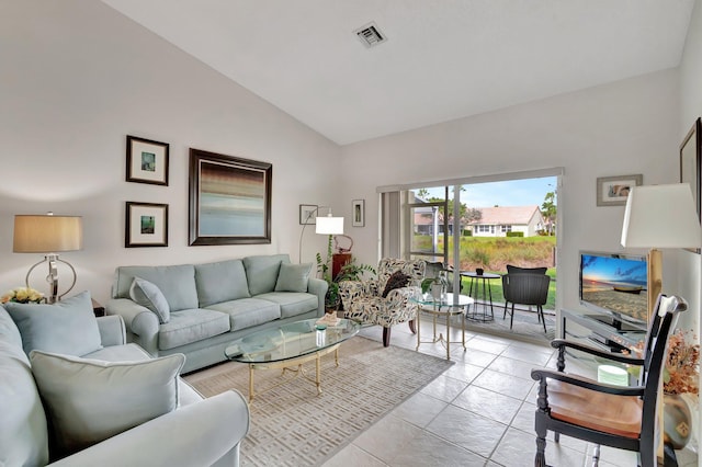 tiled living room with high vaulted ceiling