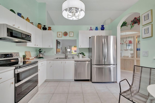 kitchen with white cabinets, a healthy amount of sunlight, and stainless steel appliances