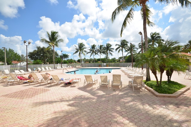 view of swimming pool featuring a patio area