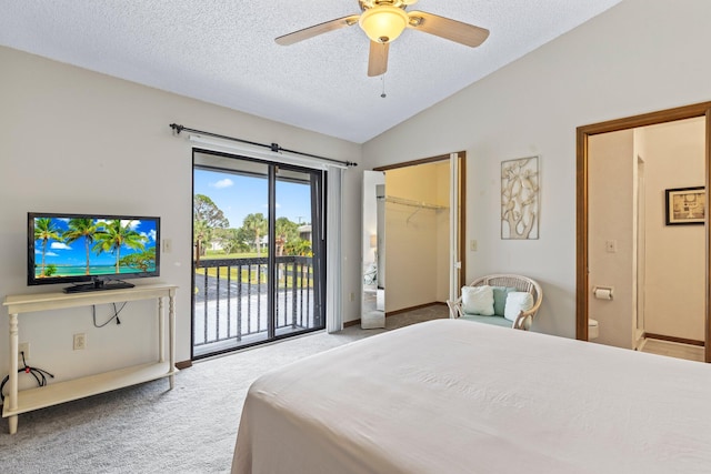 bedroom featuring lofted ceiling, access to exterior, carpet, ceiling fan, and a closet