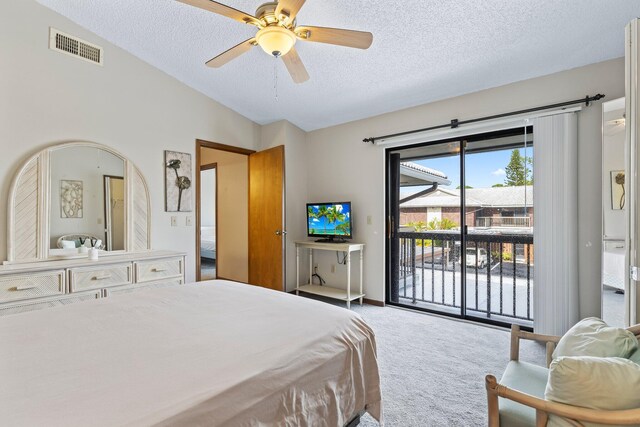 1904 SE Sir Lancelot Dr Unit 0, Port Saint Lucie, FL 34952 - bedroom with carpet, access to exterior, a textured ceiling, vaulted ceiling, and ceiling fan