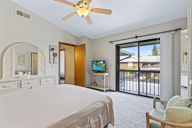 carpeted bedroom featuring a textured ceiling, access to outside, lofted ceiling, and ceiling fan