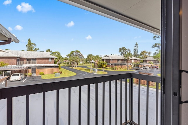 balcony featuring a residential view