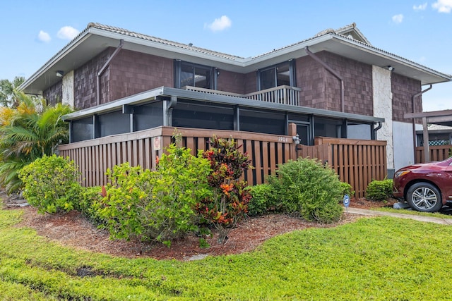 view of side of home featuring a yard