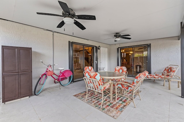view of patio / terrace featuring outdoor dining space and a ceiling fan