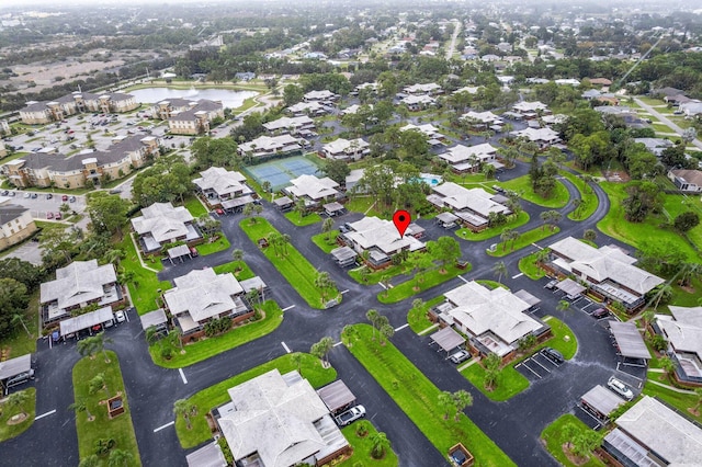 bird's eye view featuring a residential view and a water view