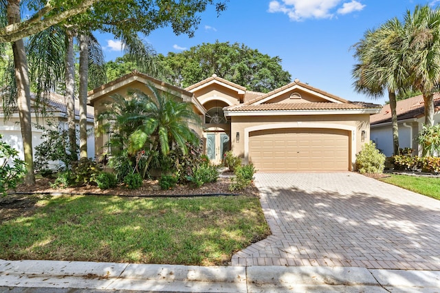 mediterranean / spanish-style house featuring a garage