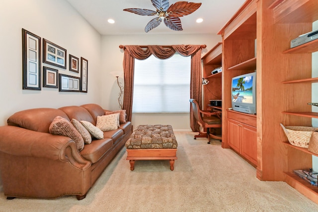 living room with ceiling fan and light colored carpet