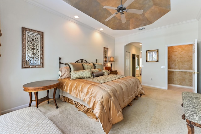 carpeted bedroom featuring ceiling fan and ornamental molding