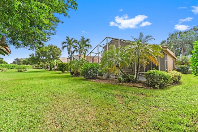 view of yard featuring glass enclosure