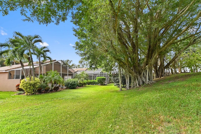 view of yard with a lanai