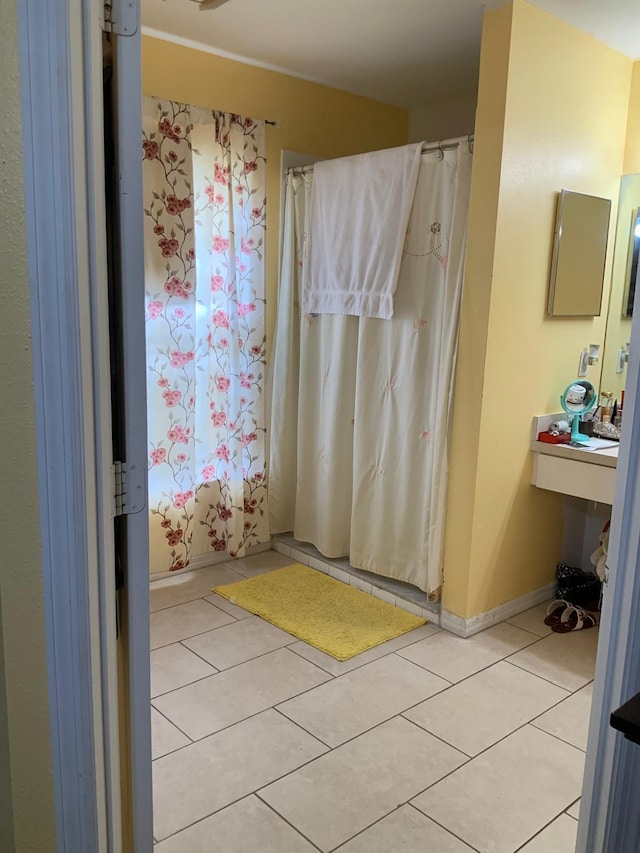 bathroom with tile patterned floors