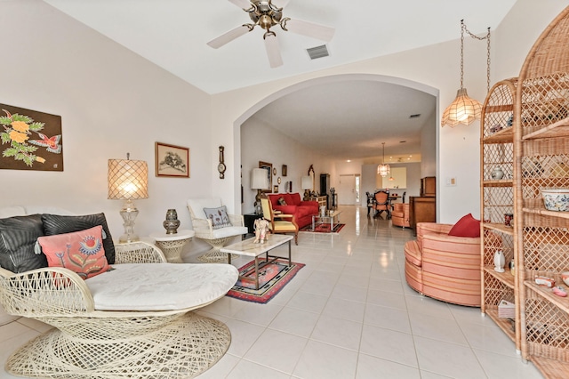 tiled living room with ceiling fan