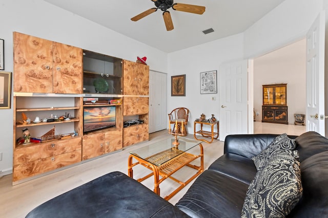 living room with ceiling fan