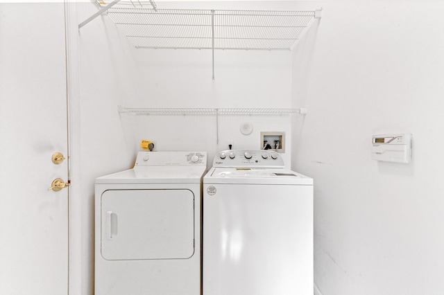 laundry room with independent washer and dryer