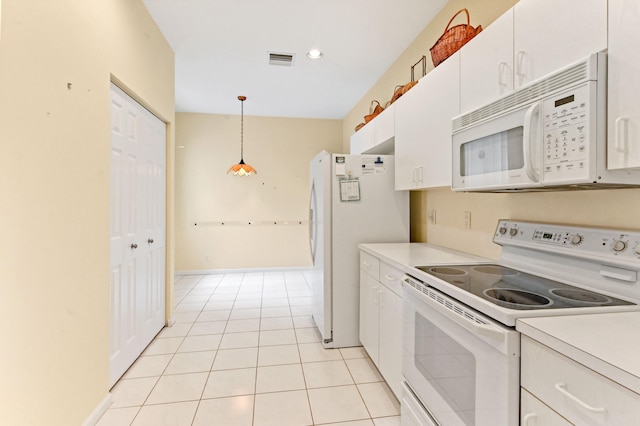 kitchen with pendant lighting, white cabinetry, white appliances, and light tile patterned floors