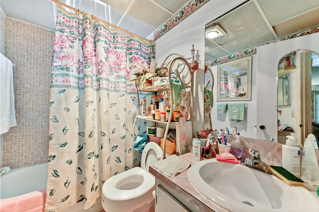 full bathroom with vanity, shower / bathtub combination with curtain, and toilet