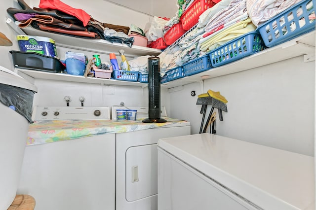washroom with independent washer and dryer