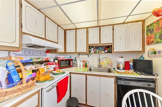 kitchen featuring a drop ceiling, black appliances, and sink
