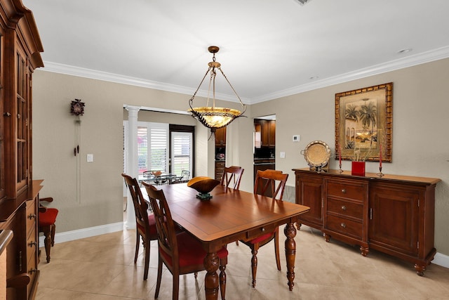 dining area with decorative columns, light tile patterned floors, and ornamental molding