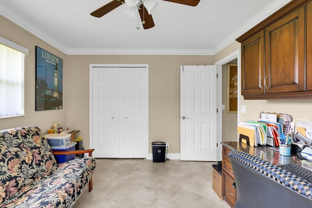 interior space with ceiling fan and crown molding