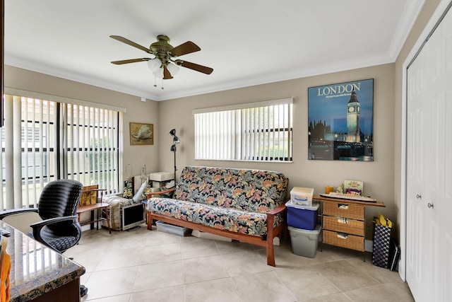 tiled living room featuring ceiling fan and crown molding