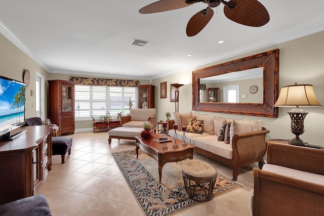 tiled living room featuring ceiling fan and ornamental molding