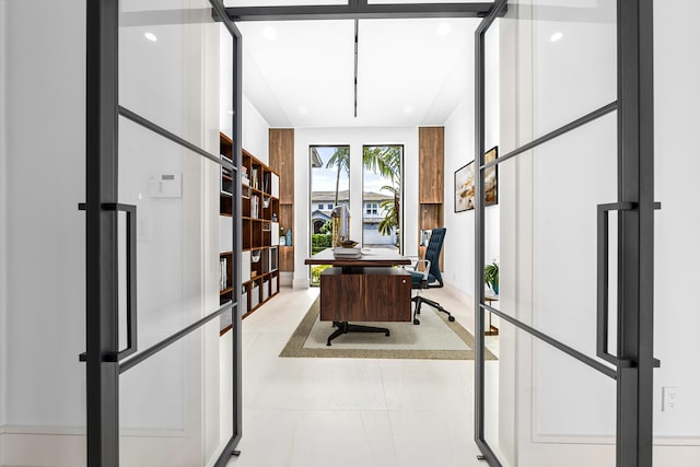 office with tile patterned floors and recessed lighting