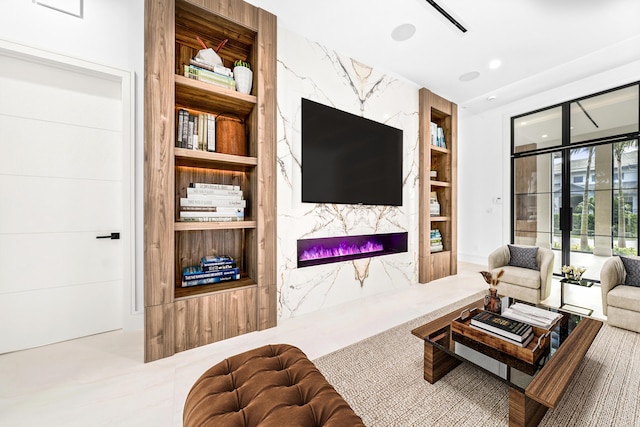 living room with built in shelves, a fireplace, and recessed lighting