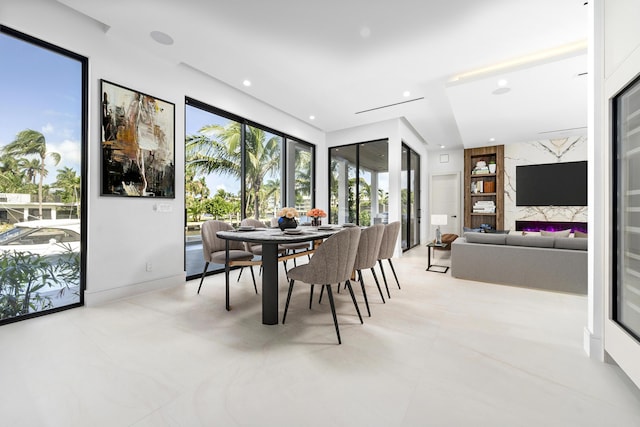 dining room featuring recessed lighting and baseboards