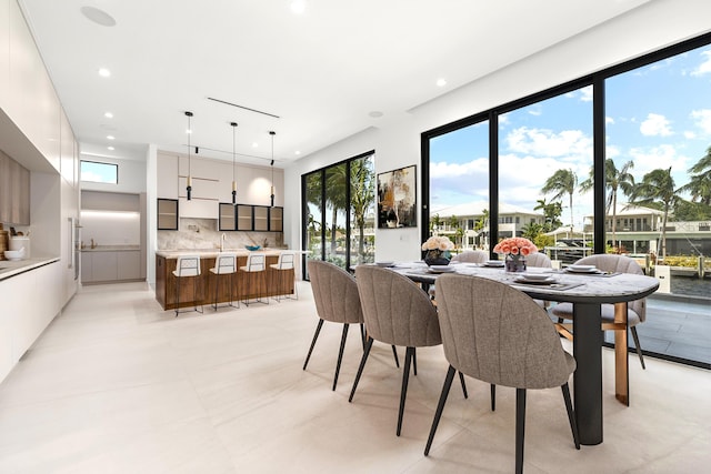 dining space featuring recessed lighting