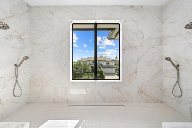 bathroom with a marble finish shower