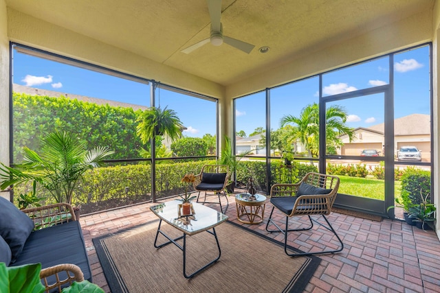 sunroom / solarium with ceiling fan