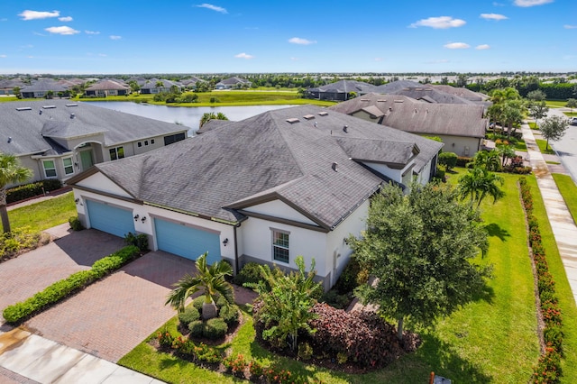 birds eye view of property with a water view