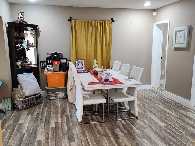 bathroom with hardwood / wood-style floors, vanity, and toilet