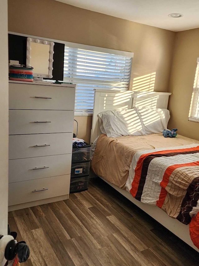 bedroom featuring dark hardwood / wood-style floors