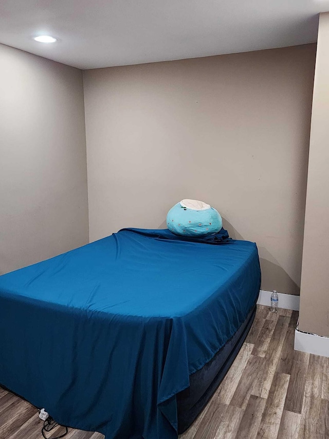 bedroom featuring wood-type flooring