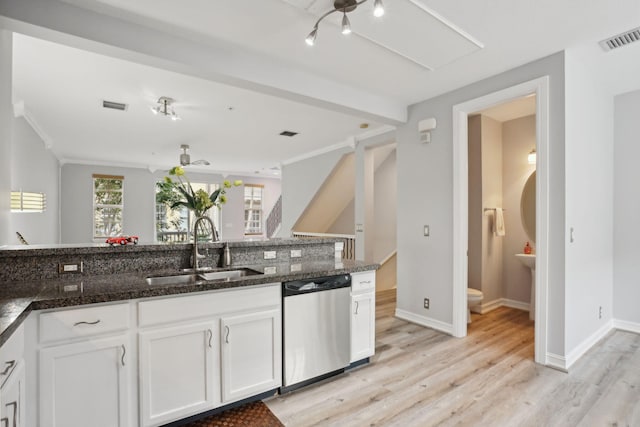 112 W Coda Cir, Delray Beach, FL 33444 - kitchen with stainless steel dishwasher, a sink, light wood-style flooring, white cabinetry, and dark stone countertops
