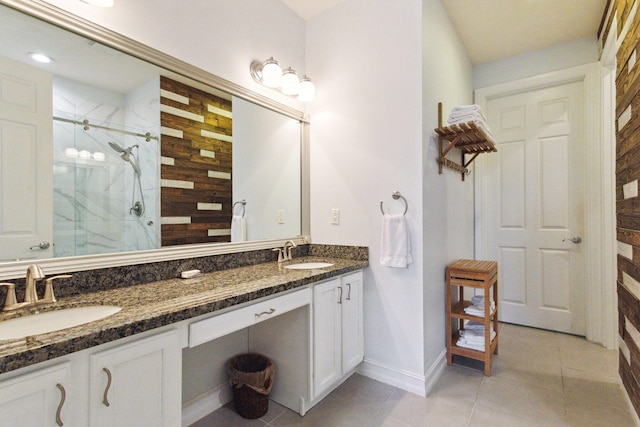 bathroom featuring tile patterned floors, vanity, and a shower with shower door