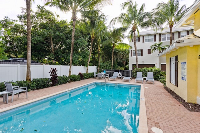 view of swimming pool with a patio