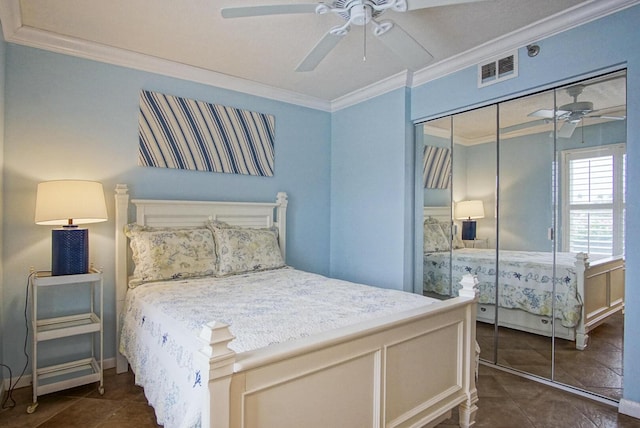 tiled bedroom featuring ceiling fan, a closet, and crown molding