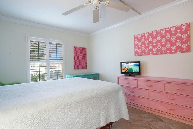 tiled bedroom featuring ceiling fan and crown molding