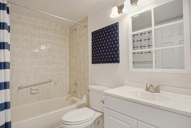 full bathroom featuring shower / bath combo, toilet, and vanity