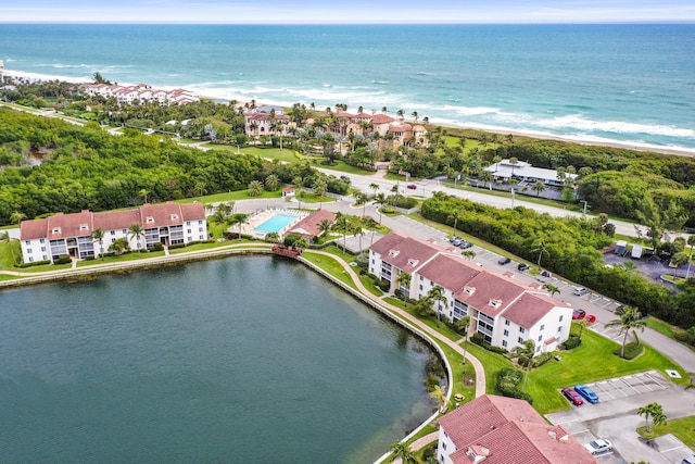 bird's eye view featuring a water view and a view of the beach