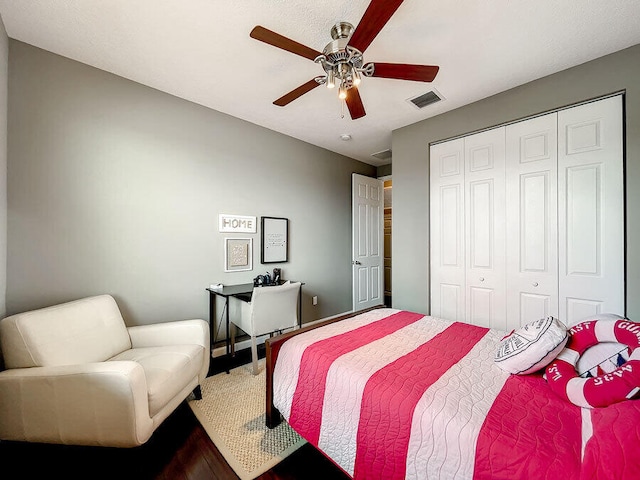 bedroom with ceiling fan and a closet