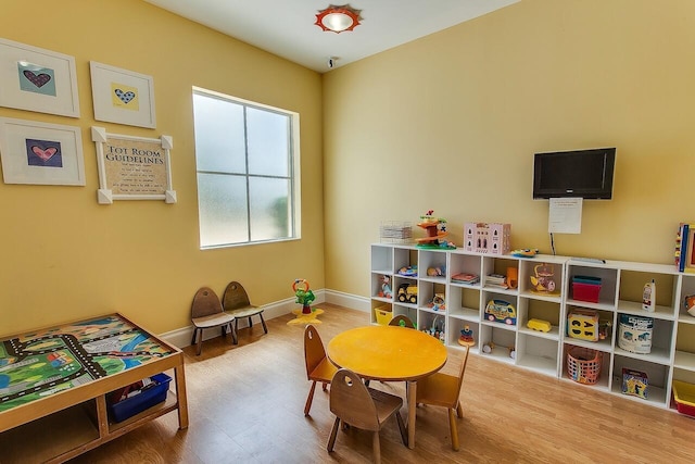 playroom with hardwood / wood-style flooring