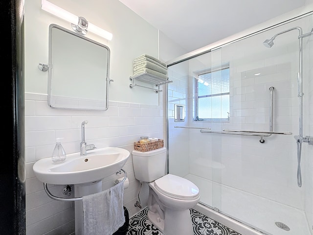 bathroom featuring an enclosed shower, tile walls, and toilet