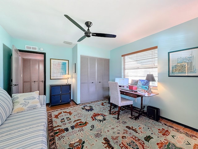 office area with ceiling fan and light hardwood / wood-style floors